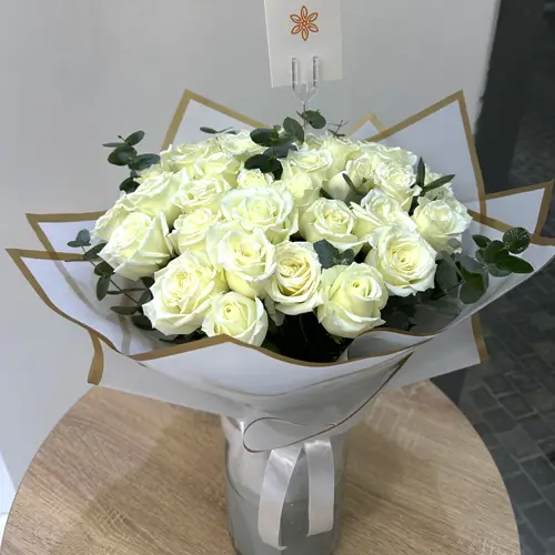 White Roses In Glass Vases